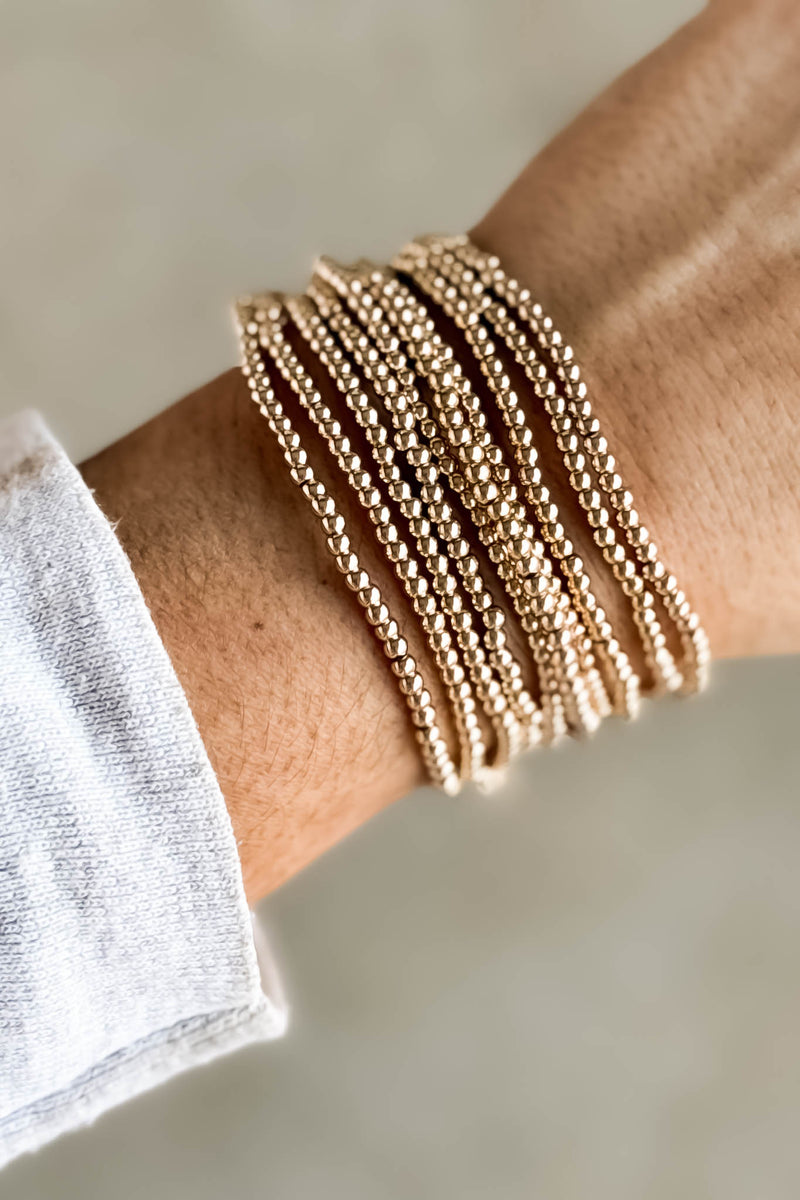 Set Of Ten Mini Bead Gold Bracelets
