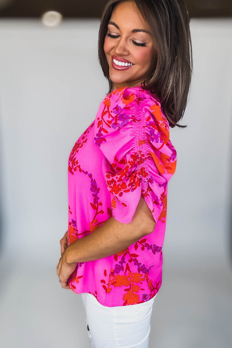 FUCHSIA ORANGE SHORT RUCHED SLEEVE FLORAL BLOUSE